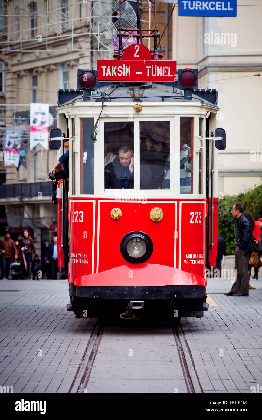 ISTANBUL, TURKEY - APRIL 14 : Red vintage tram on Taksim Istiklal Street on April 14, 2013 in Istanbul, Turkey. Taksim Istiklal Stock Photo