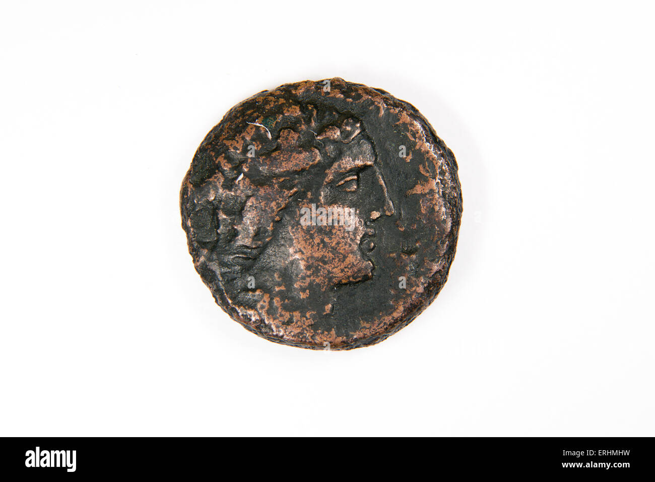 Old bronze coin with portrait on a white background Stock Photo