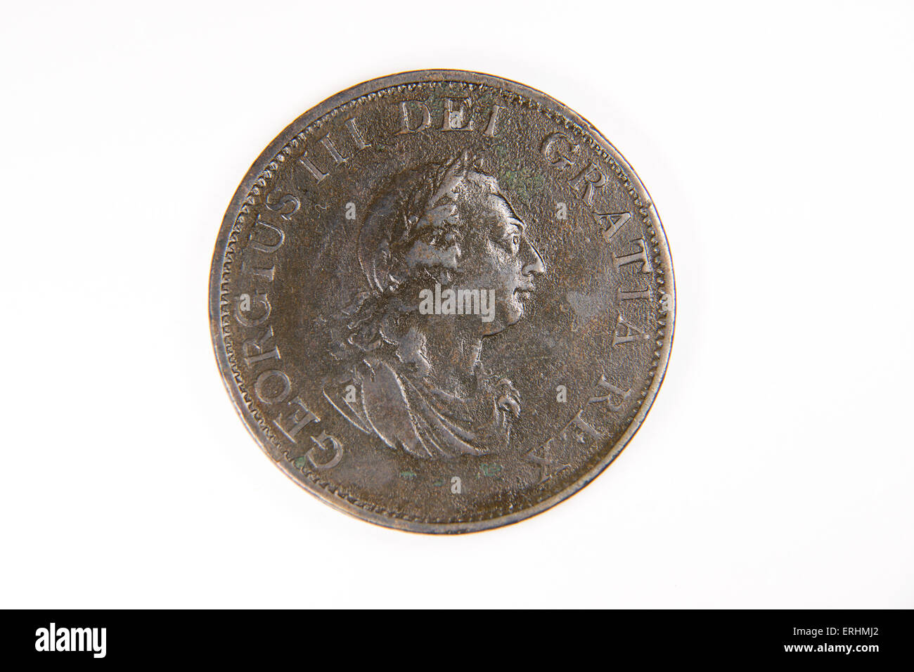 Old bronze coin with portrait of king on a white background Stock Photo