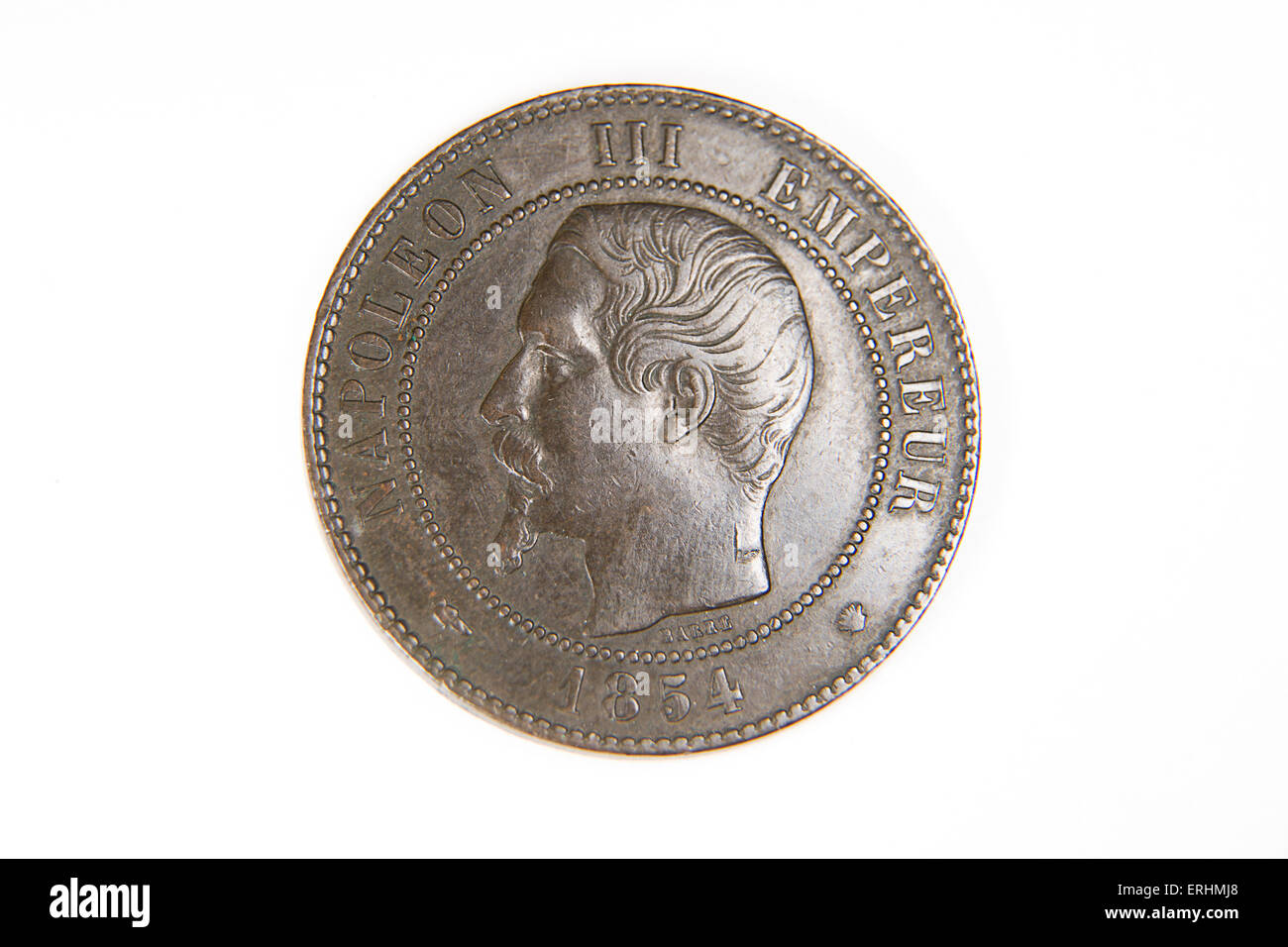 Old bronze coin with portrait of king on a white background Stock Photo