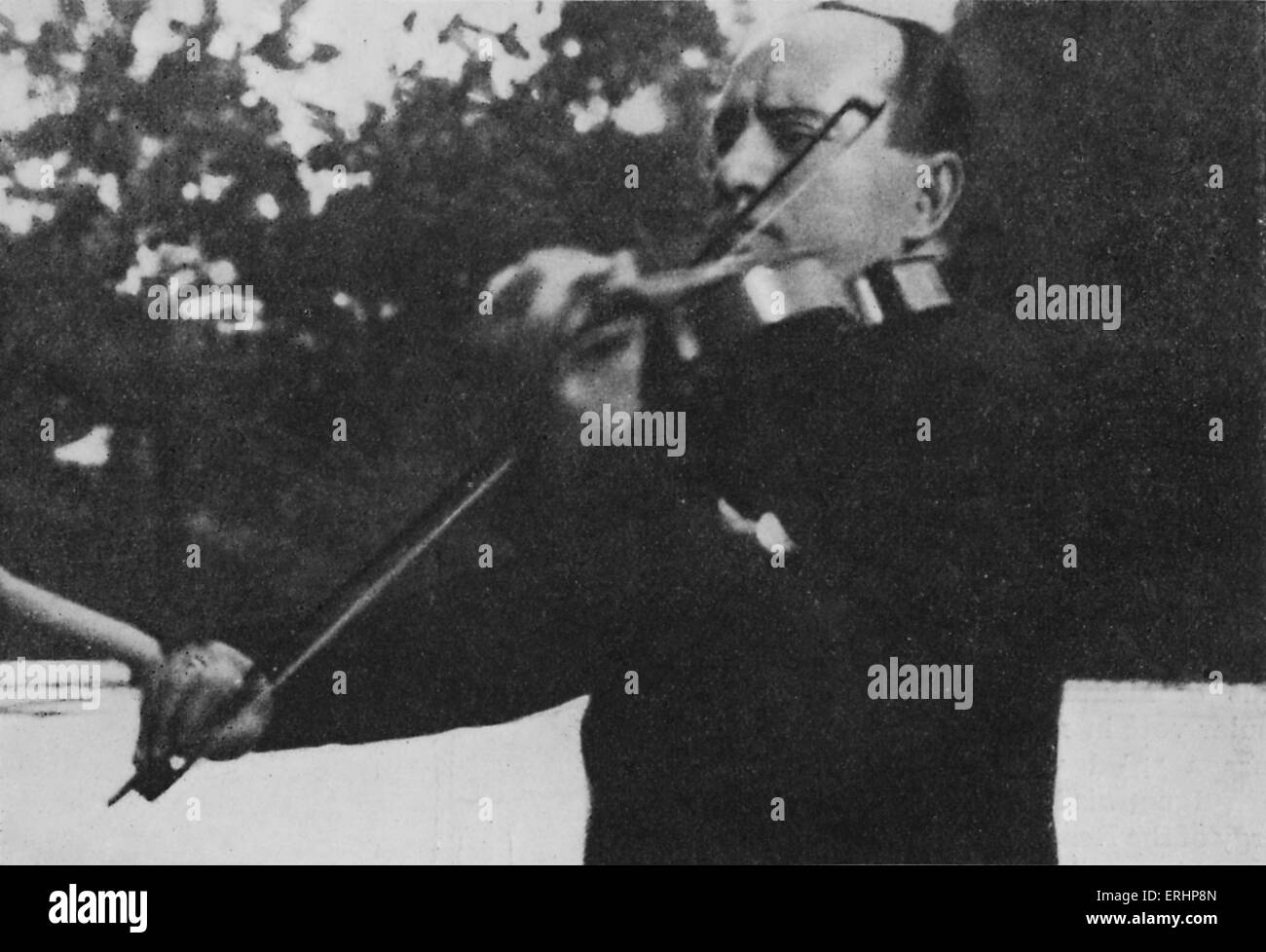 Benito Mussolini playing the violin - on the terrace of the villa Torlonia. Italian Prime minister from 1922 - 1943. Founder of Stock Photo