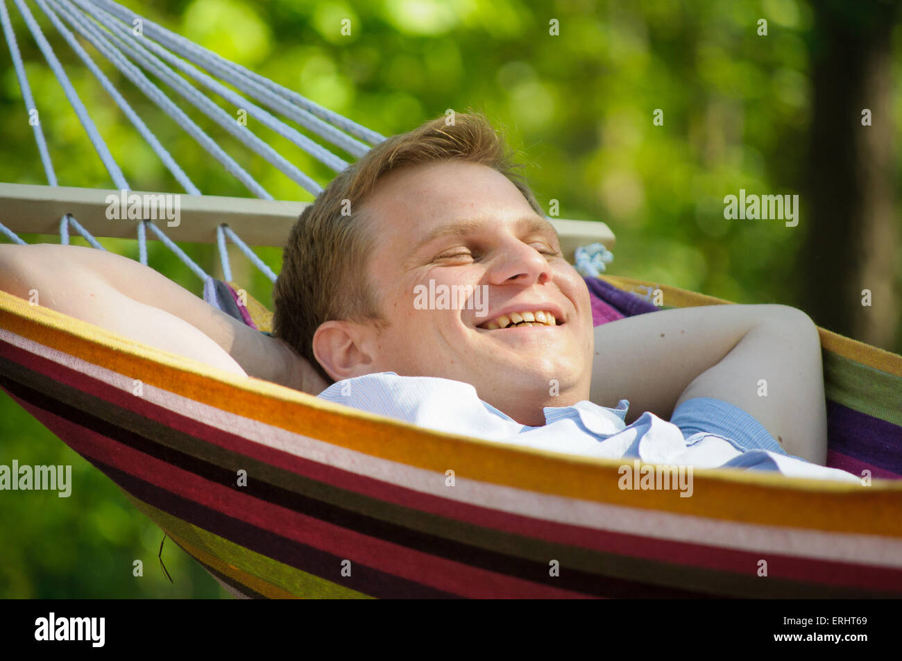 Young man sleeping in a hammock Stock Photo