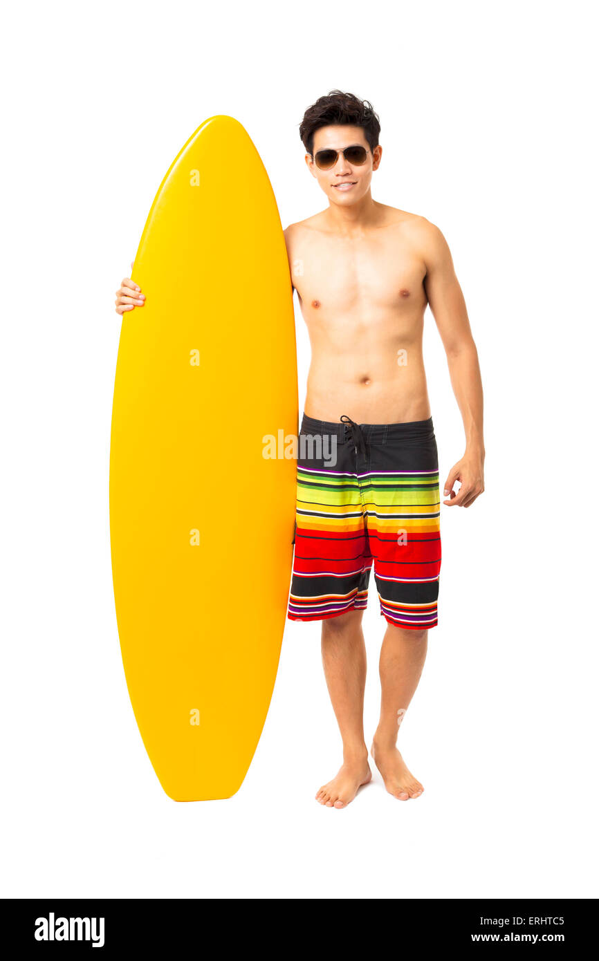 full length young man holding surfboard Stock Photo