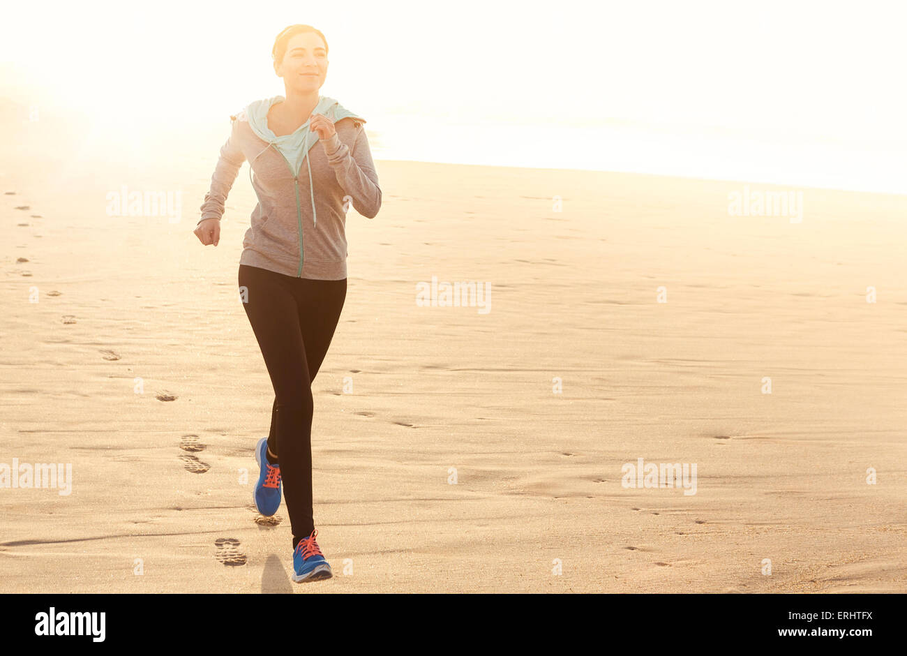 Beautiful and healthy woman running on the beach Stock Photo Alamy