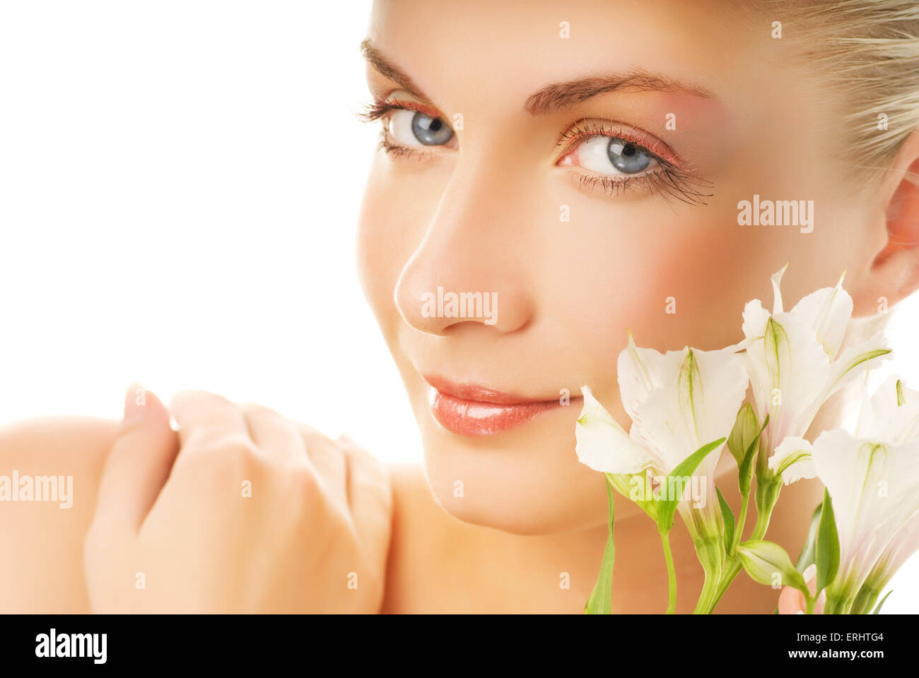 Beautiful young woman with white flowers Stock Photo - Alamy