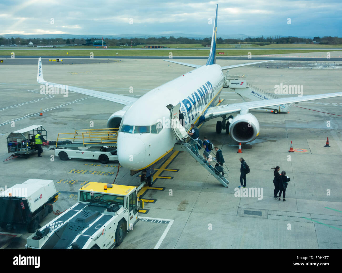 People boarding Ryanair flight Manchester airport. UK Stock Photo