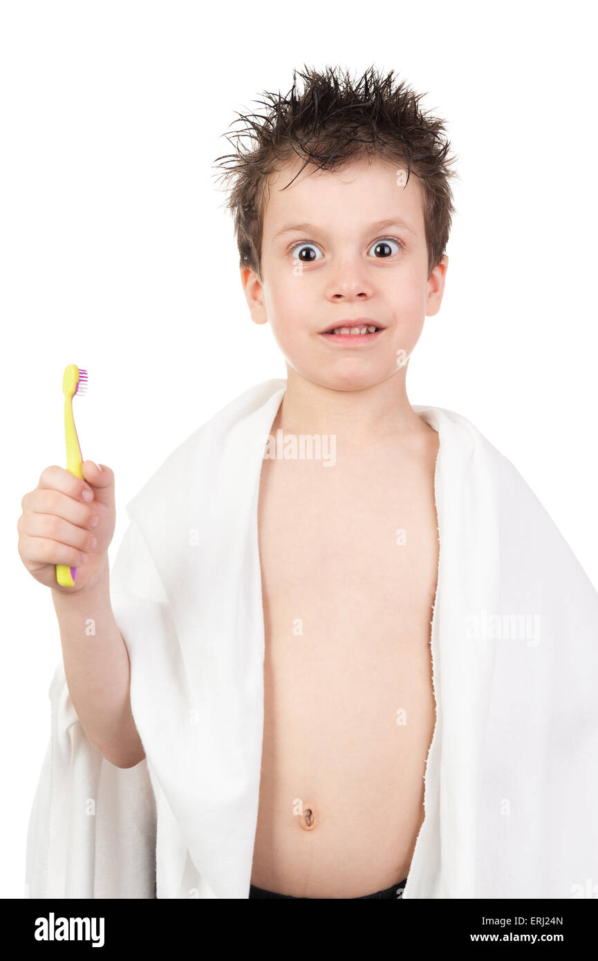 child in towel with wet hair brushing teeth Stock Photo Alamy