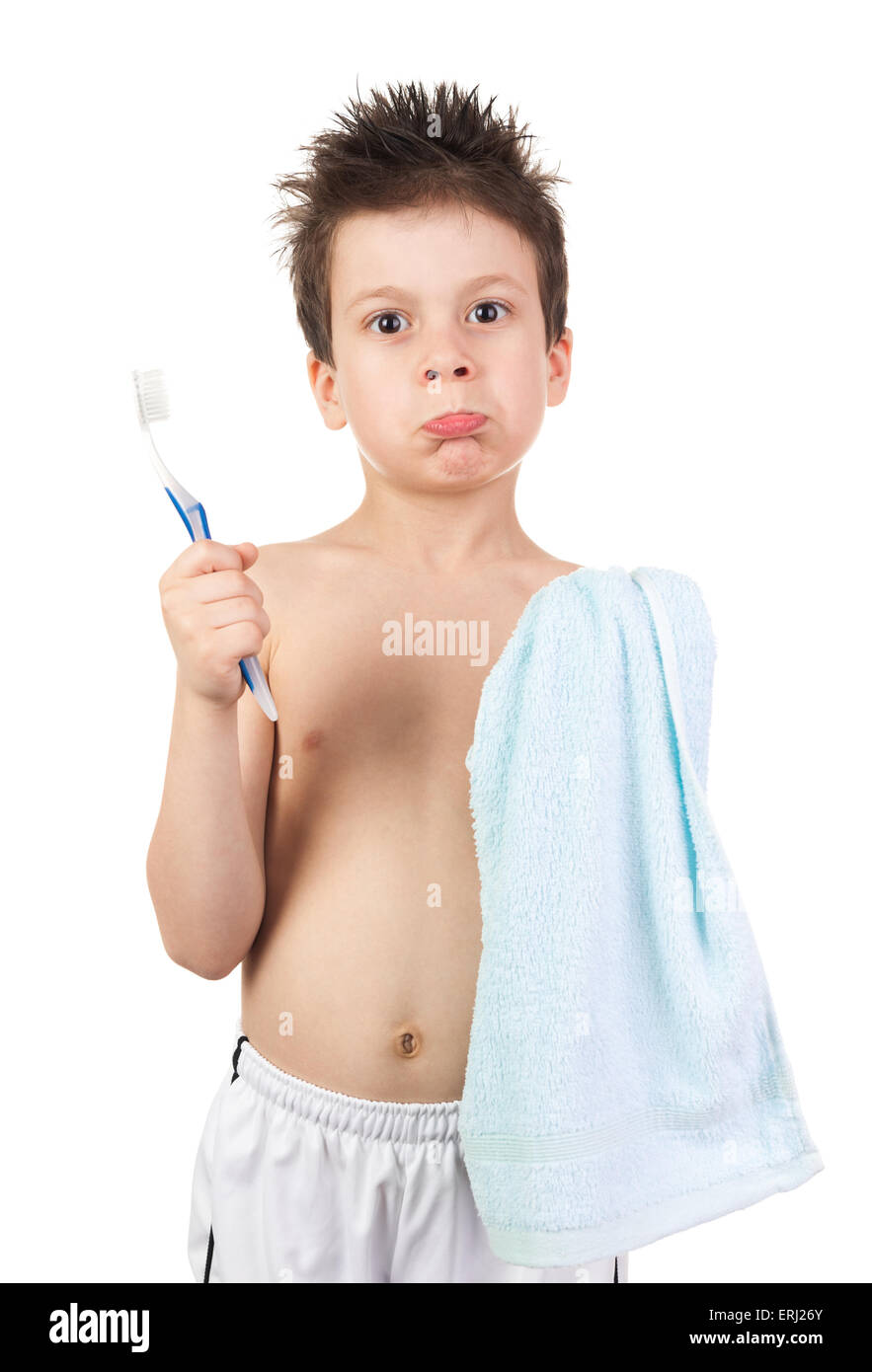 child in towel with wet hair brushing teeth Stock Photo Alamy