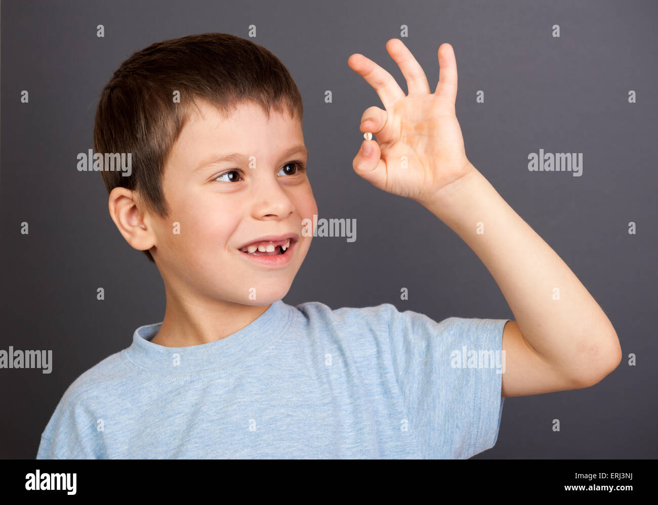 Boy Looks At Lost Tooth Stock Photo Alamy
