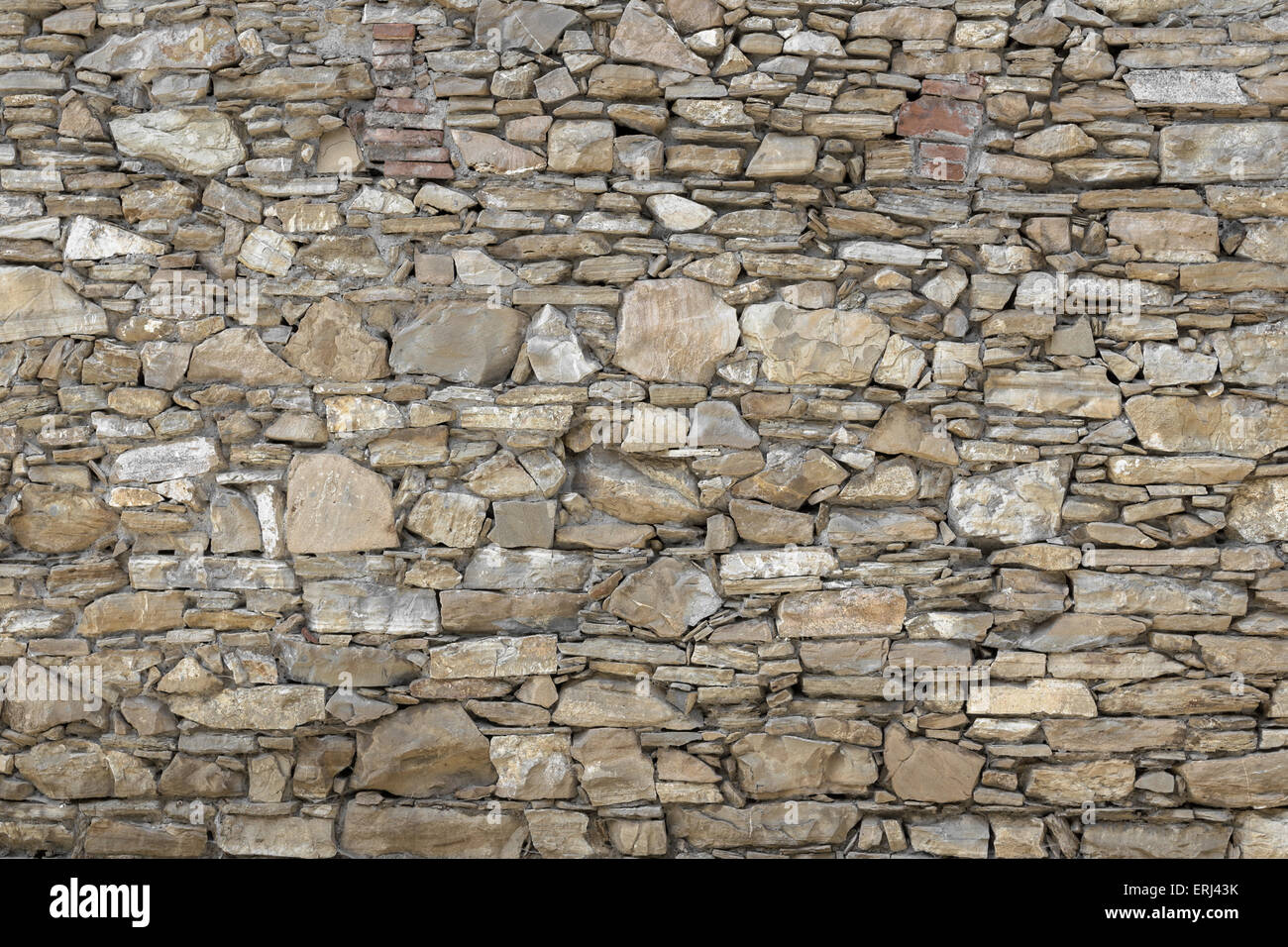 Front view of a wall made up of irregular stones Stock Photo Alamy
