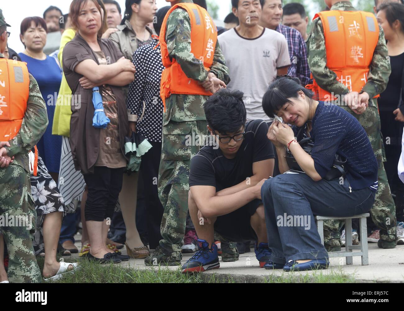 Jianli, China. 03rd June, 2015. Relatives of the travellers in the sank ship "Eastern Star" on the bank of the Yangtze River are waiting for the new message for recurring in Jianli county, Hubei province, central China, 3th June 2015. The ship, Carrying 406 passengers, five travel agency workers and 47 crew members, sank at around 9:28 p.m. (1328 GMT) on Monday,  according to the Xinhua News Agency Said. Credit:  Panda Eye/Alamy Live News Stock Photo
