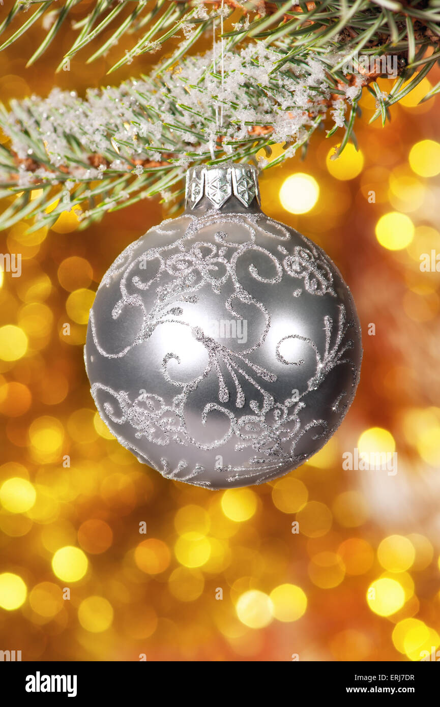 christmas ball on fir tree branch and golden background Stock Photo - Alamy