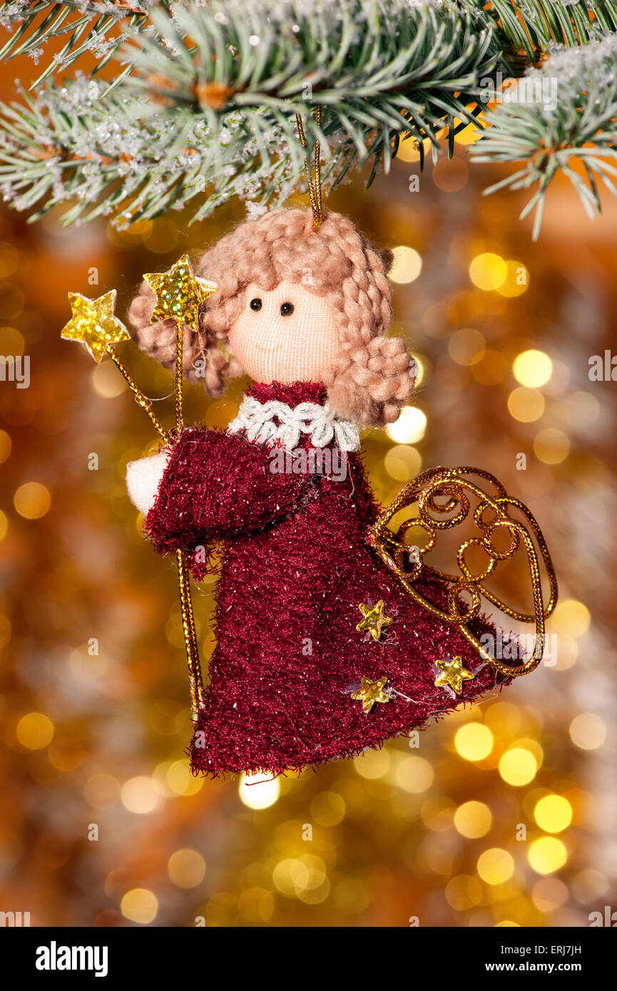 christmas angel on fir tree branch and golden background Stock Photo Alamy