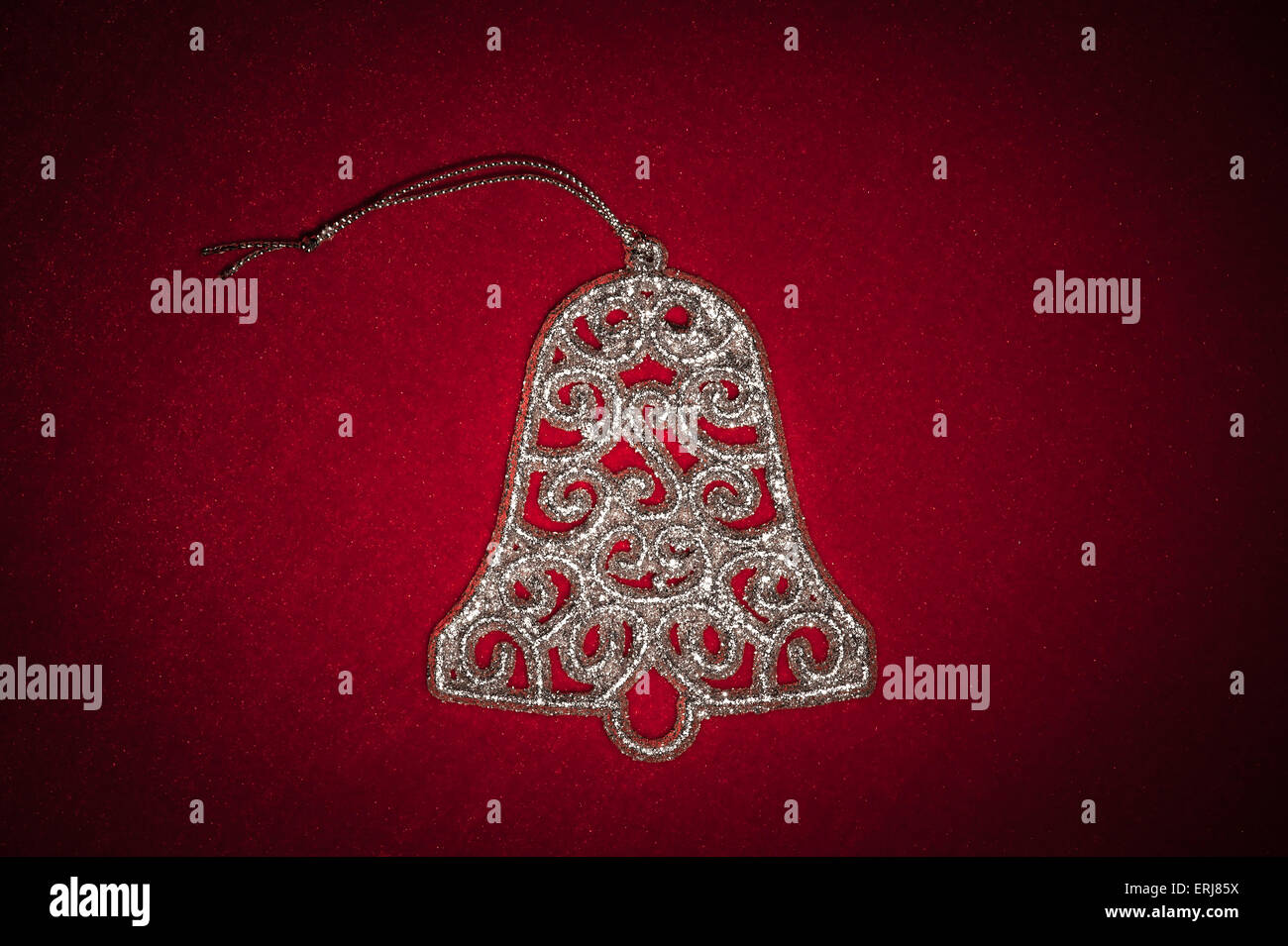 christmas silver bell on red Stock Photo