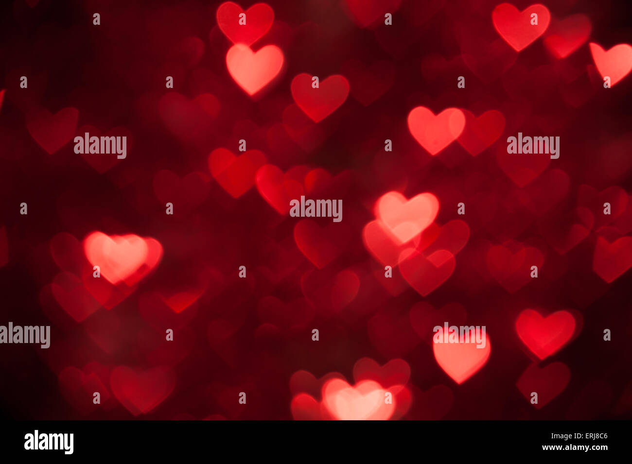 red heart bokeh as background Stock Photo - Alamy