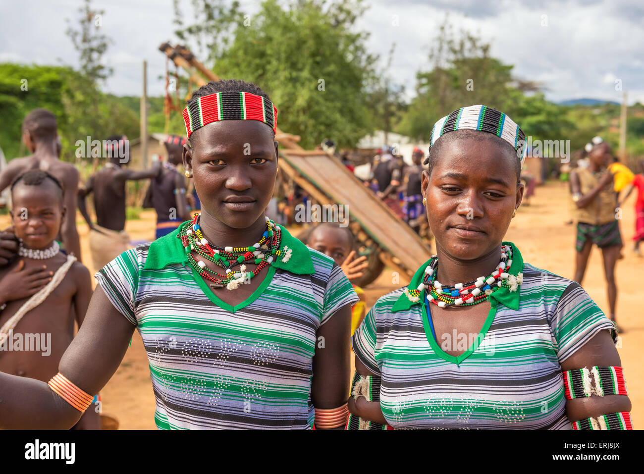 Two girls from the Hamar tribe with traditional jewelry at a popular local market. Stock Photo