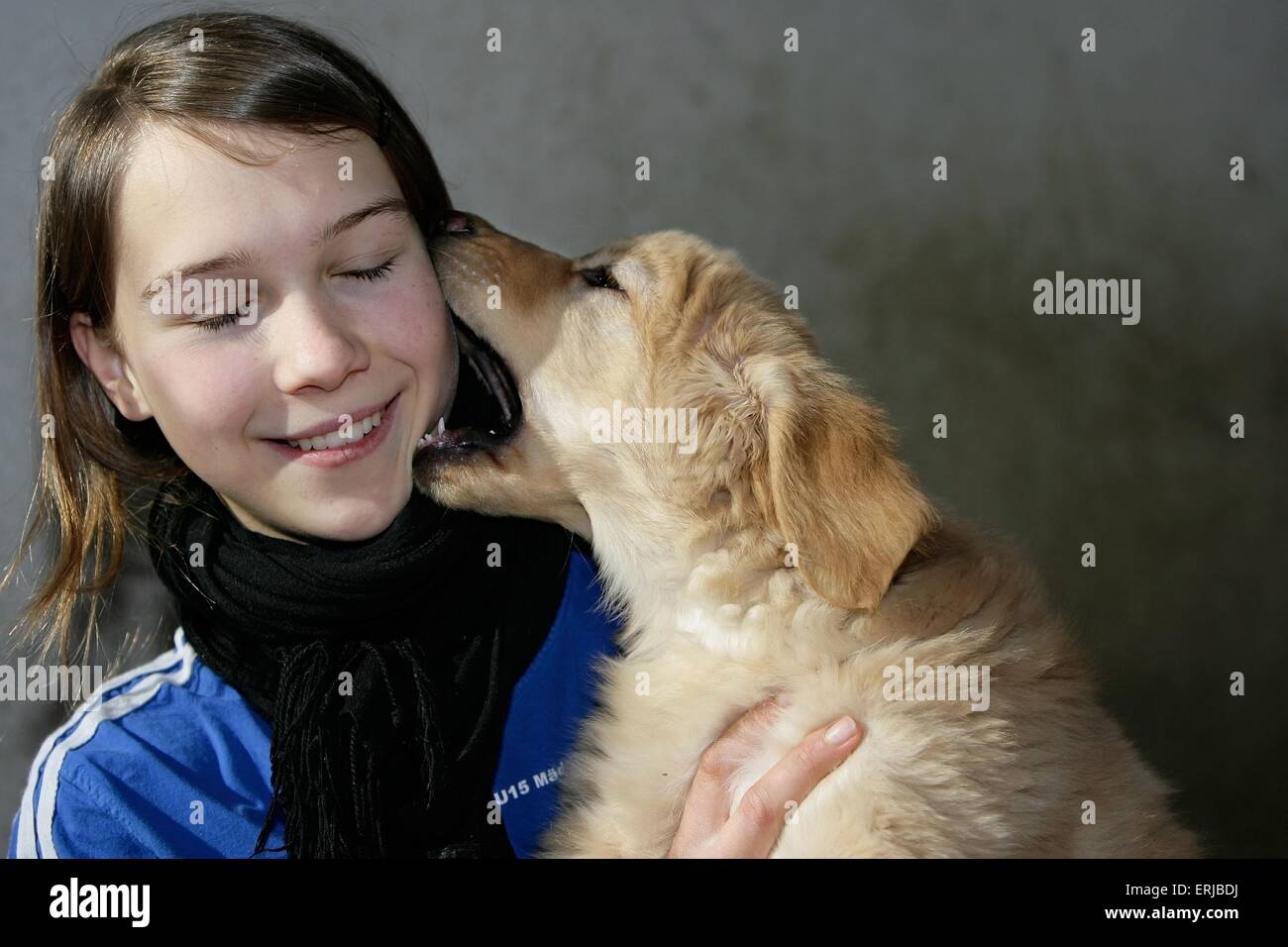 girl with Hovawart Puppy Stock Photo