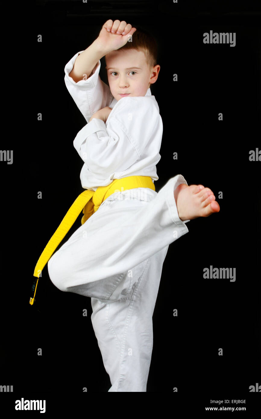 Yellow belt. Young boy practicing karate Stock Photo - Alamy