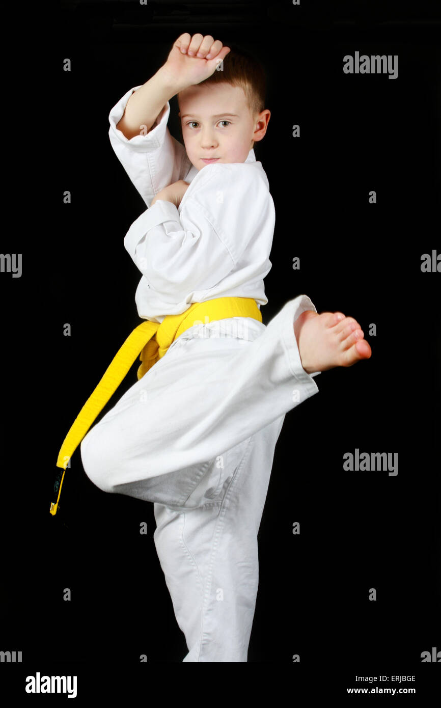Yellow belt. Young boy practicing karate Stock Photo Alamy