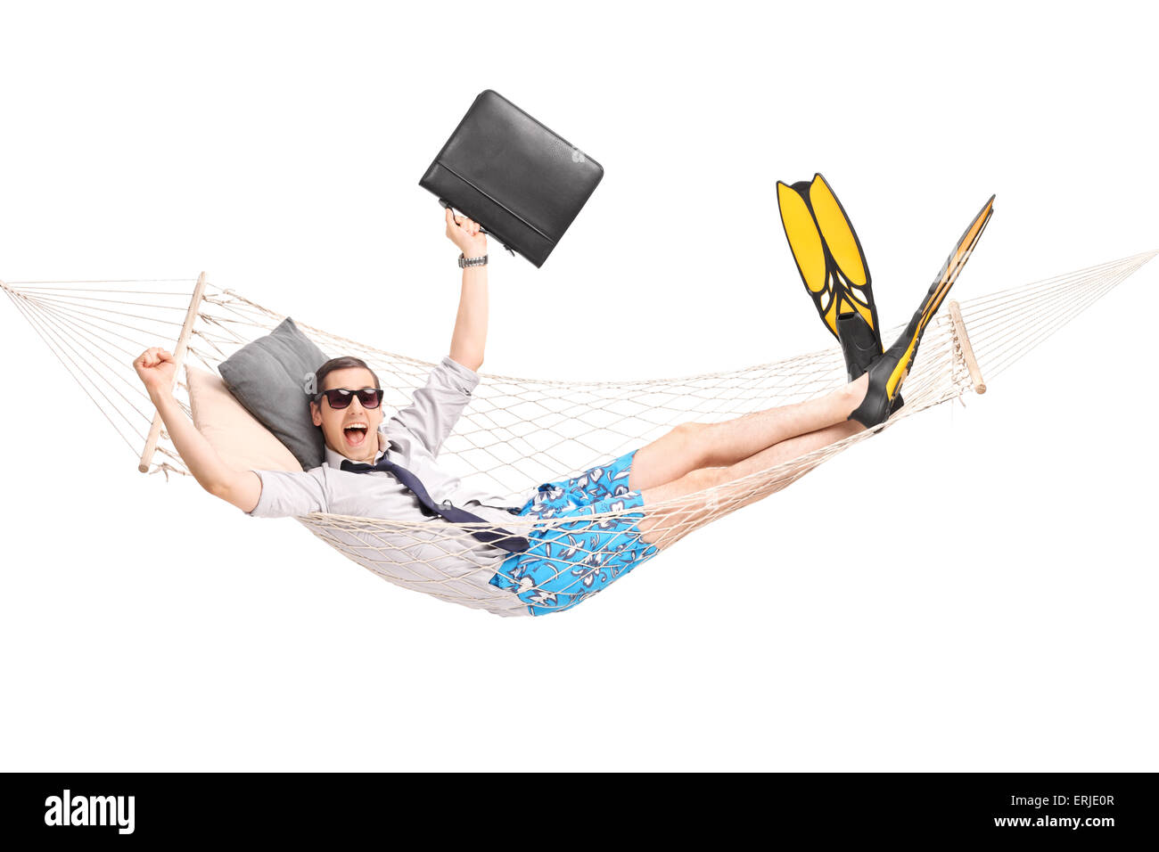 Happy businessman lying in a hammock and gesturing joy with his hands isolated on white background Stock Photo