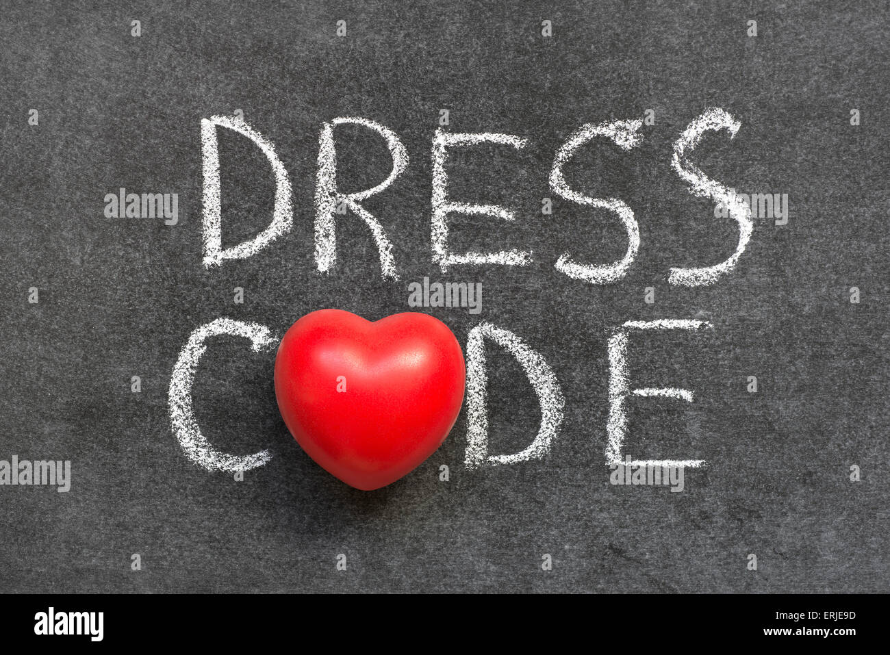 dress code phrase handwritten on blackboard with heart symbol instead of O Stock Photo