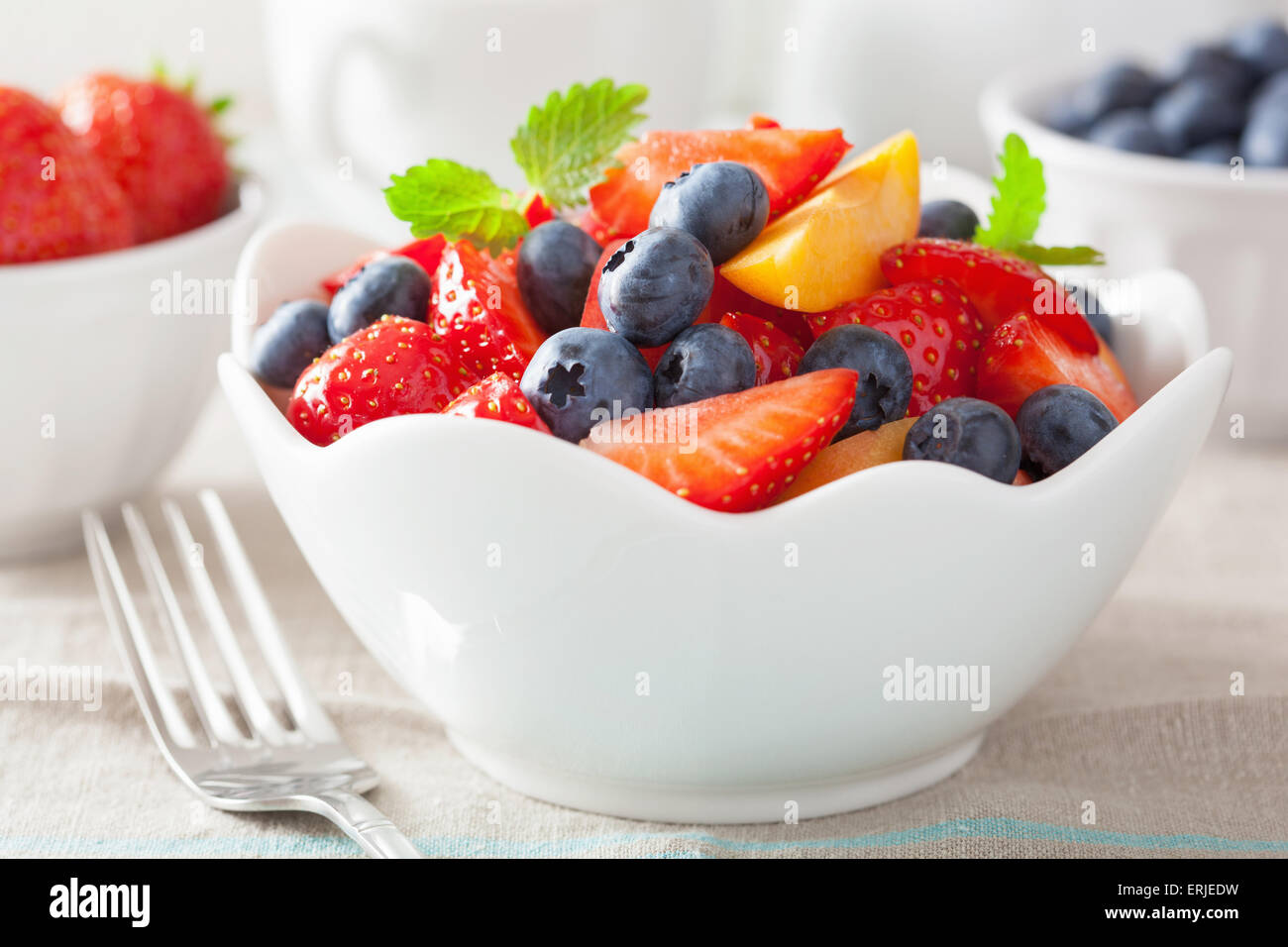 fruit salad with strawberry blueberry apricot Stock Photo Alamy