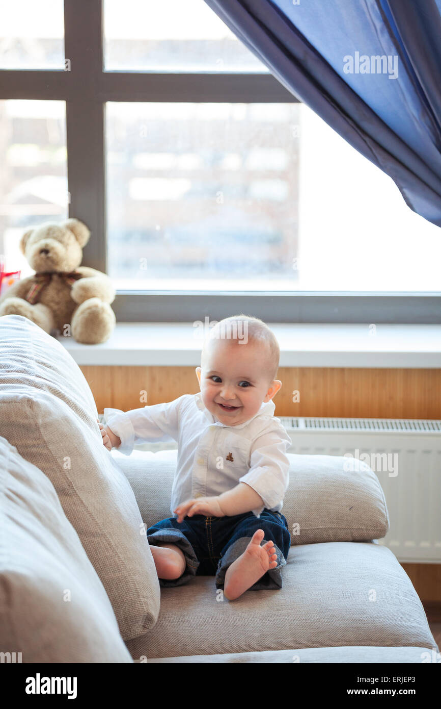 Baby boy on couch Stock Photo Alamy