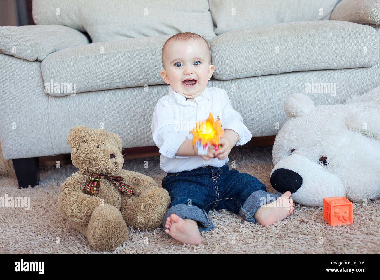 Playful baby boy with toys Stock Photo - Alamy