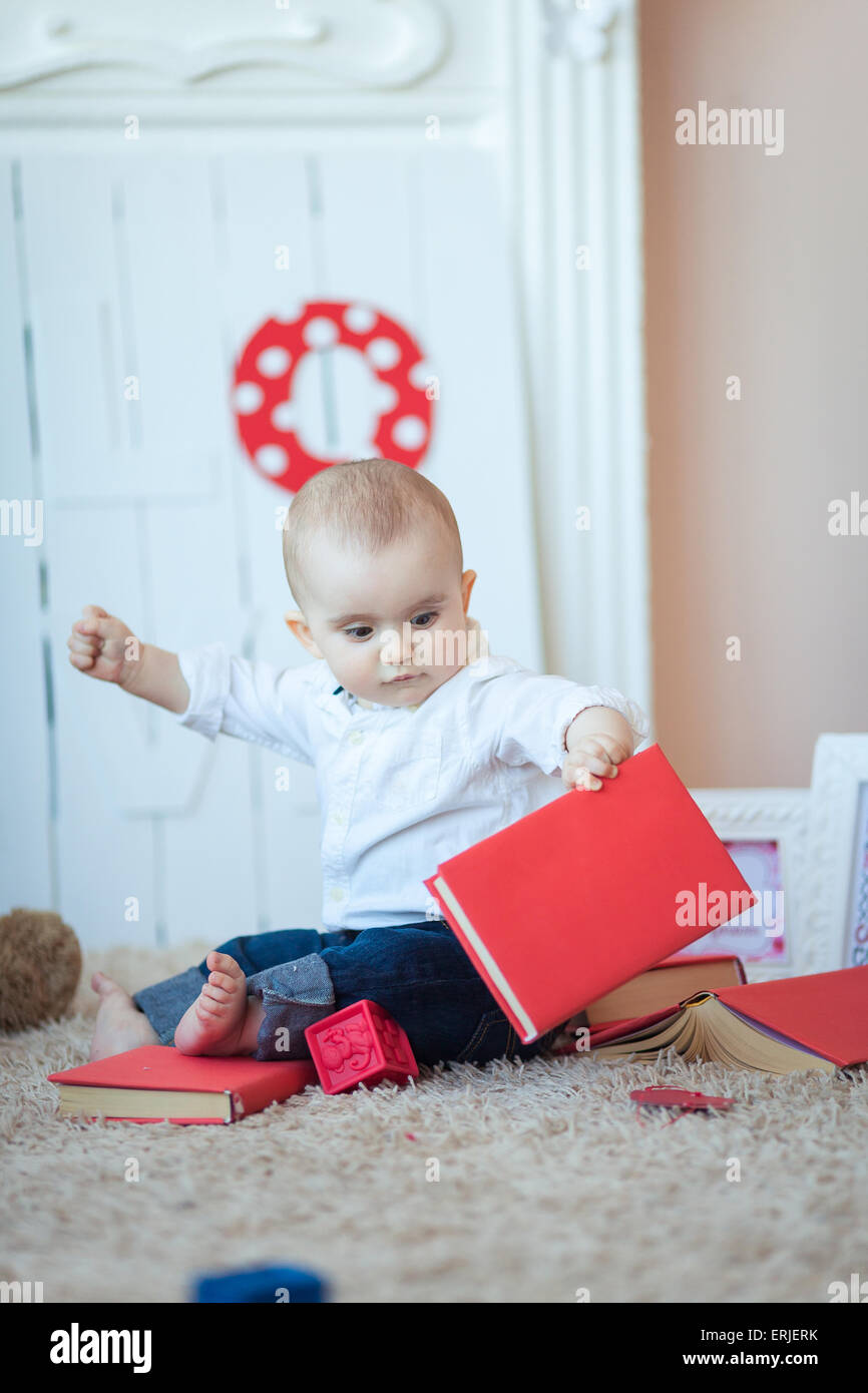 Funny baby with books Stock Photo Alamy