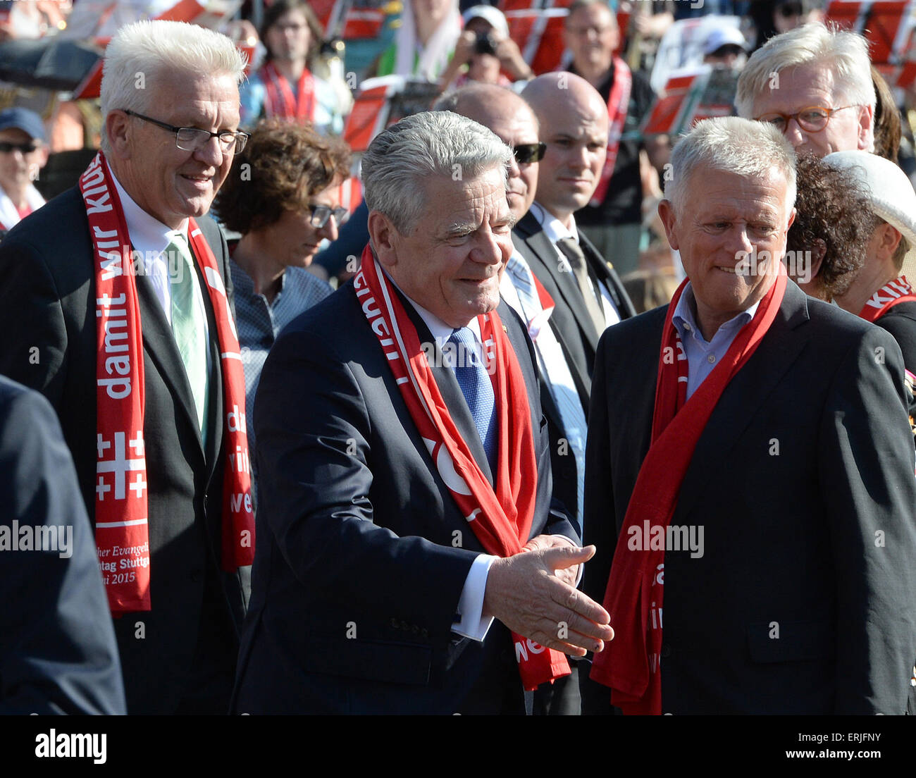 Stuttgart, Germany. 03rd June, 2015. German President Joachim Gauck (C) greets Church Congress attendees at the opening worship service at the 2015 German Evangelical Church Congress in Stuttgart, Germany, 03 June 2015. Minister President of Baden-Wuerttemberg Winfried Kretschmann stands to the left and mayor of Stuttgart Fritz Kuhn stands to the right. Photo: BERND WEISSBROD/dpa/Alamy Live News Stock Photo