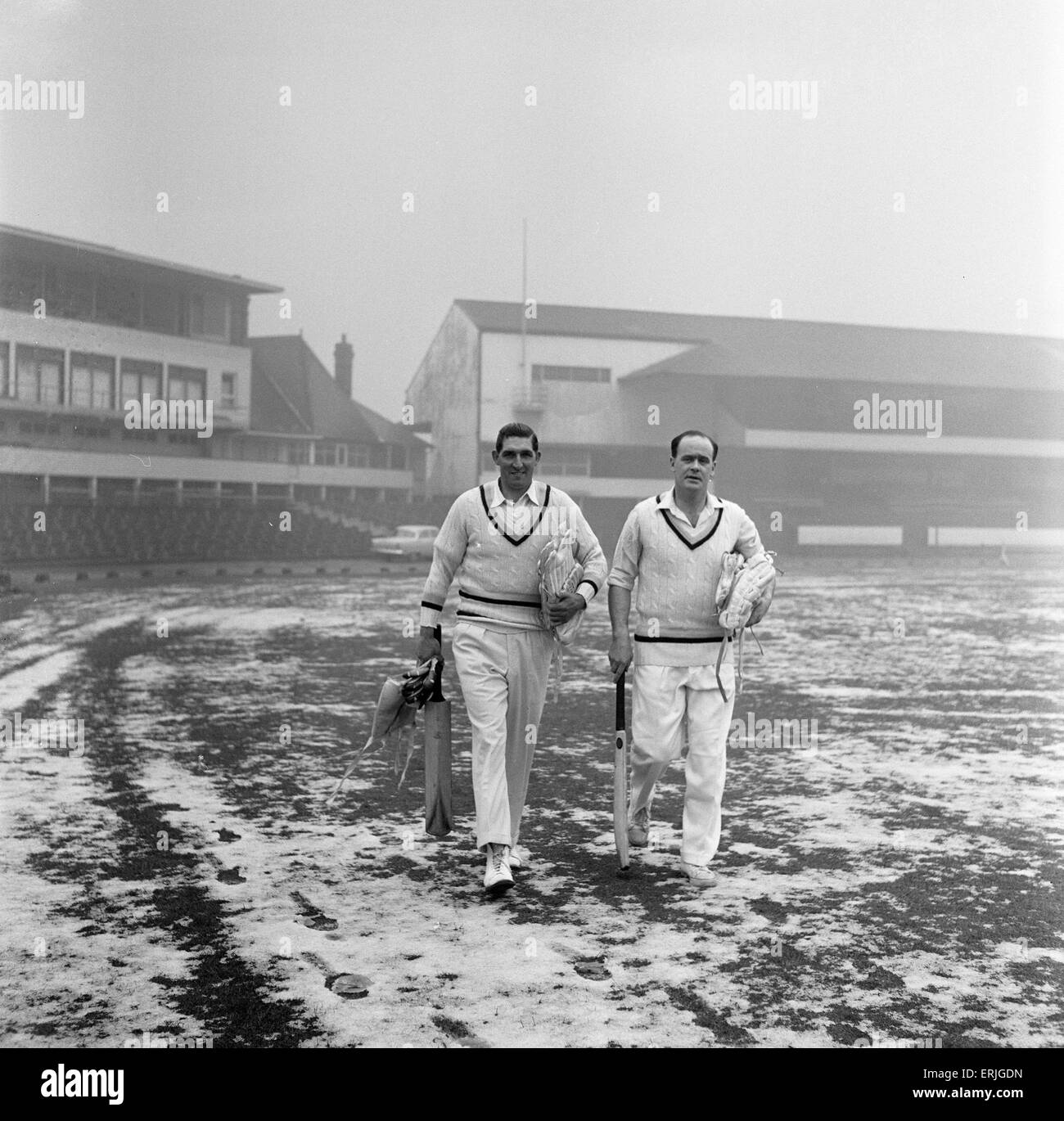 Yorkshire County Cricket Club, players head to the nets with snow still on the ground, 5th April 1961. Skipper Vic Wilson and Brian Close on their way to the practice shed. Stock Photo