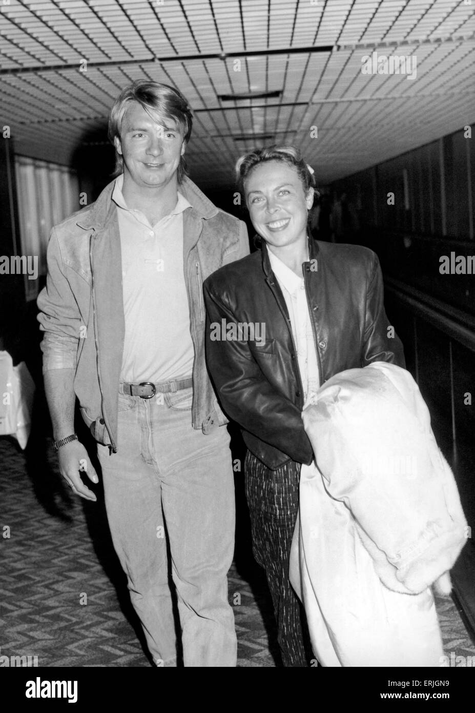 Jayne Torvill and Christopher Dean at Heathrow Airport after flying in  from New York where they received a special award for skating services. 17th March 1987 Stock Photo