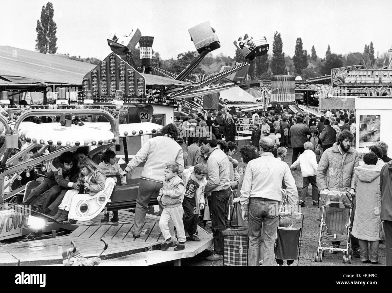 Families enjoying themselves at the Crock Fair on Hearsall Common. 29th May 1984 Stock Photo