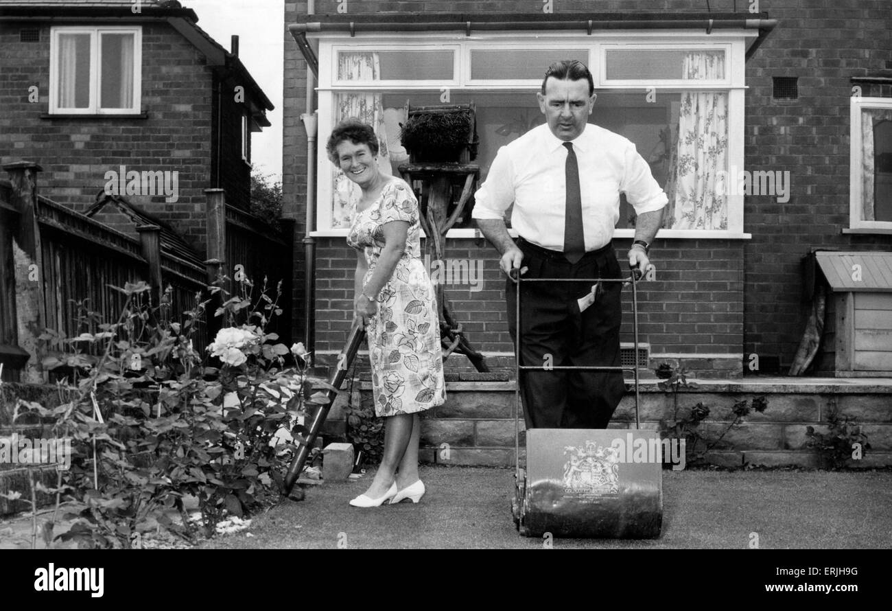 Warwickshire County Cricket Club secretary Leslie Deakins with his wife Norah working in the garden of their home. August 1966. Stock Photo