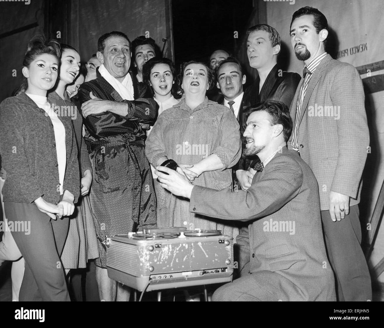 Jimmy Hill of Coventry City seen here with Sid James and the cast of Puss in Boots record The Coventry City song at the Coventry Theatre. 21st December 1962 Stock Photo
