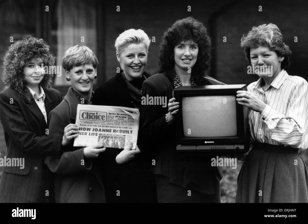 The 'Choice' advert girls present a colour TV to Sally Day, Director of the Acorns Children's Hospice, Oak Tree Lane, Selly Oak, Birmingham, 15th December 1988. Left to Right, Wendy De bie, Annie Davison, Lisa Brown, Jan Everitt. Reproduction Prohibited without the Written Consent of the Management Stock Photo