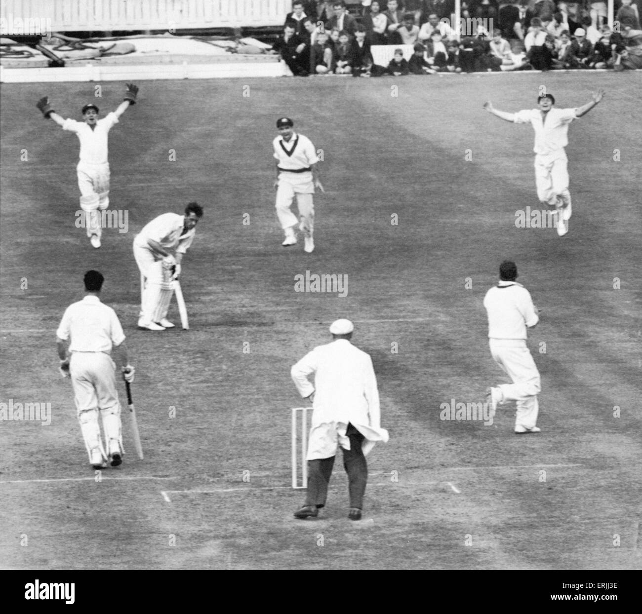Australian cricket tour of England for the Ashes. England v Australia Fourth Test match at Old Trafford. A bail flies as Brian Statham's wicket is shattered by Alan Davidson and Australia have retained the Ashes with a dynamic 54 run win at Old Trafford. Stock Photo