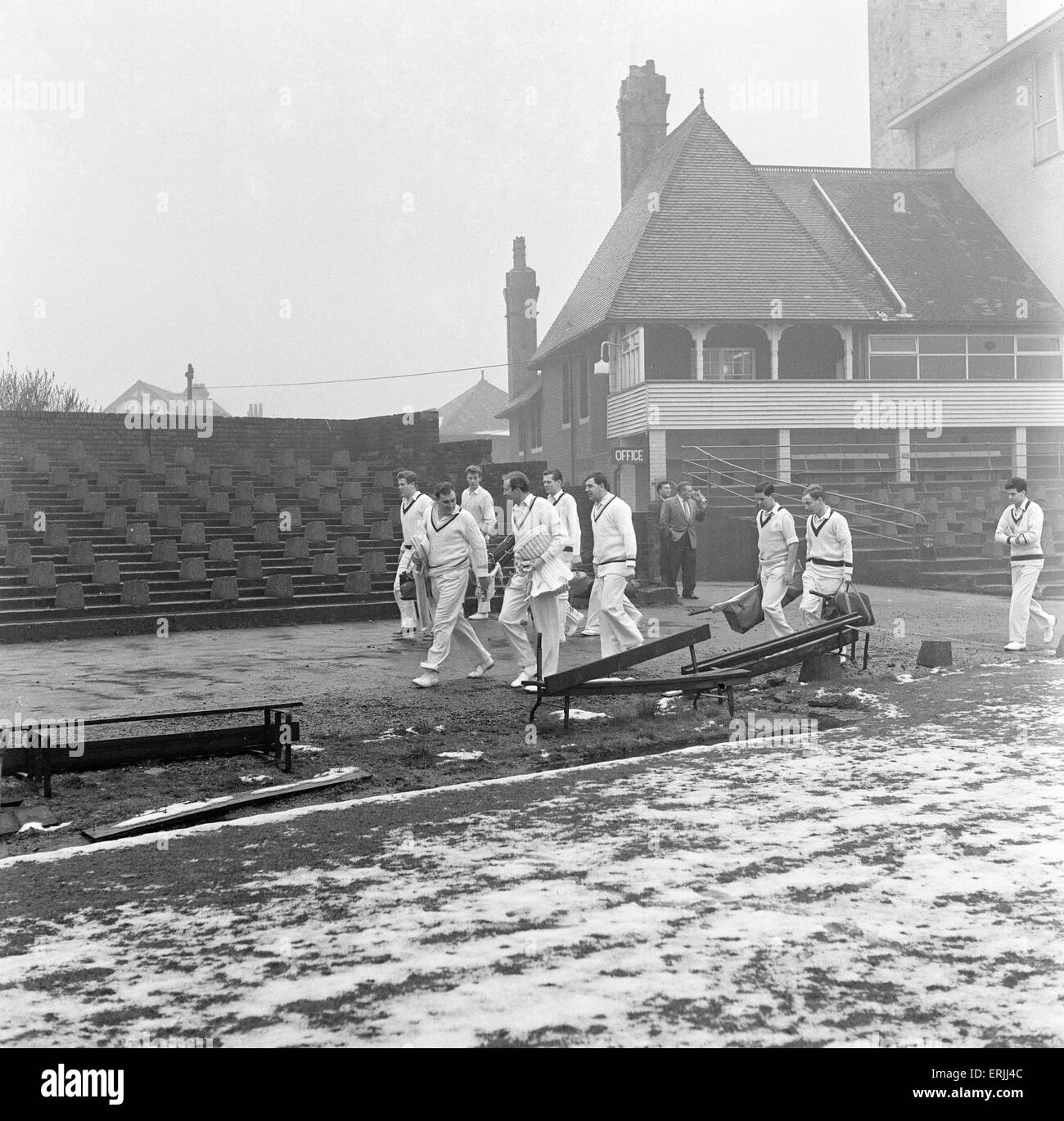 Yorkshire County Cricket Club, players head to the practice shed with snow still on the ground, 5th April 1961. Stock Photo