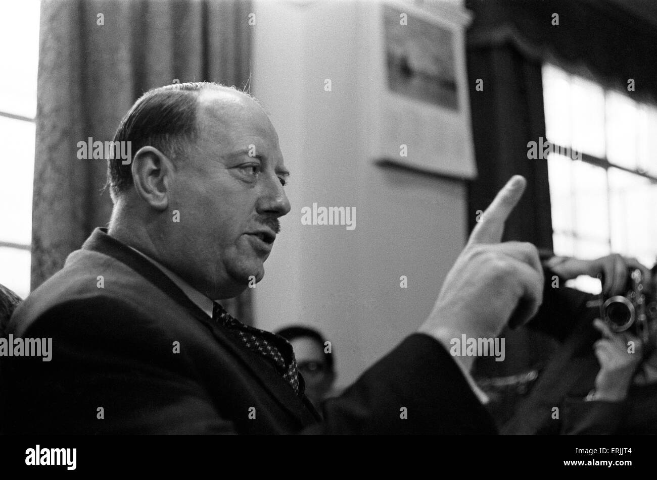 Dr Richard Beeching, Chairman of British Railways, pictured in his office, 15th March 1961. He became a household name in Britain in the early 1960s for his report 'The Reshaping of British Railways', commonly referred to as 'The Beeching Report', which led to far- reaching changes in the railway network, popularly known as the Beeching Axe. Source Wikipedia. Stock Photo