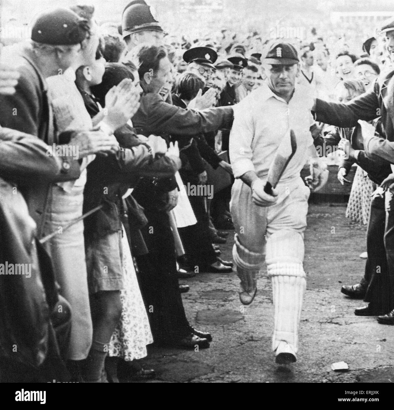 Australian cricket tour of England for the Ashes. England v Australia Third Test match at Headingley. Cyril Washbrook congratulated by fans as he exits the field. 13th July 1956. Stock Photo