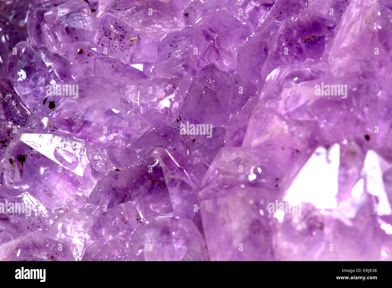 Amethyst raw stone background Stock Photo Alamy