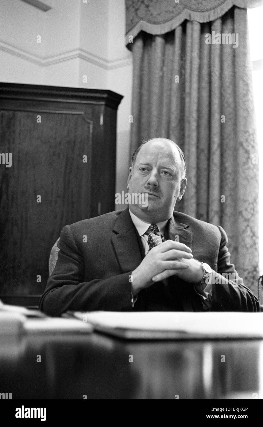 Dr Richard Beeching, Chairman of British Railways, pictured in his office, 15th March 1961. He became a household name in Britain in the early 1960s for his report "The Reshaping of British Railways", commonly referred to as "The Beeching Report", which led to far- reaching changes in the railway network, popularly known as the Beeching Axe. Source Wikipedia. Stock Photo