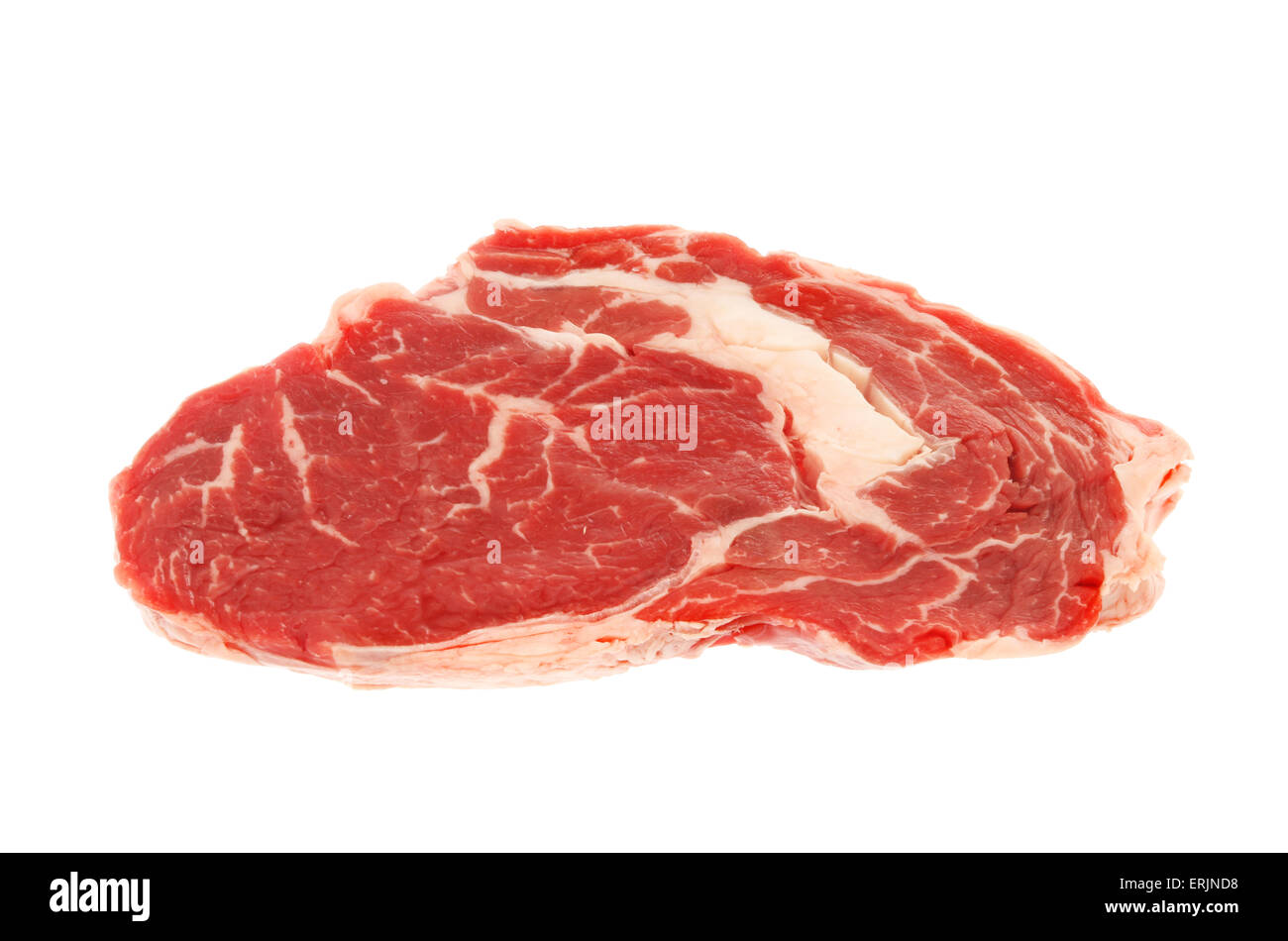 Raw rib eye steak isolated against white Stock Photo