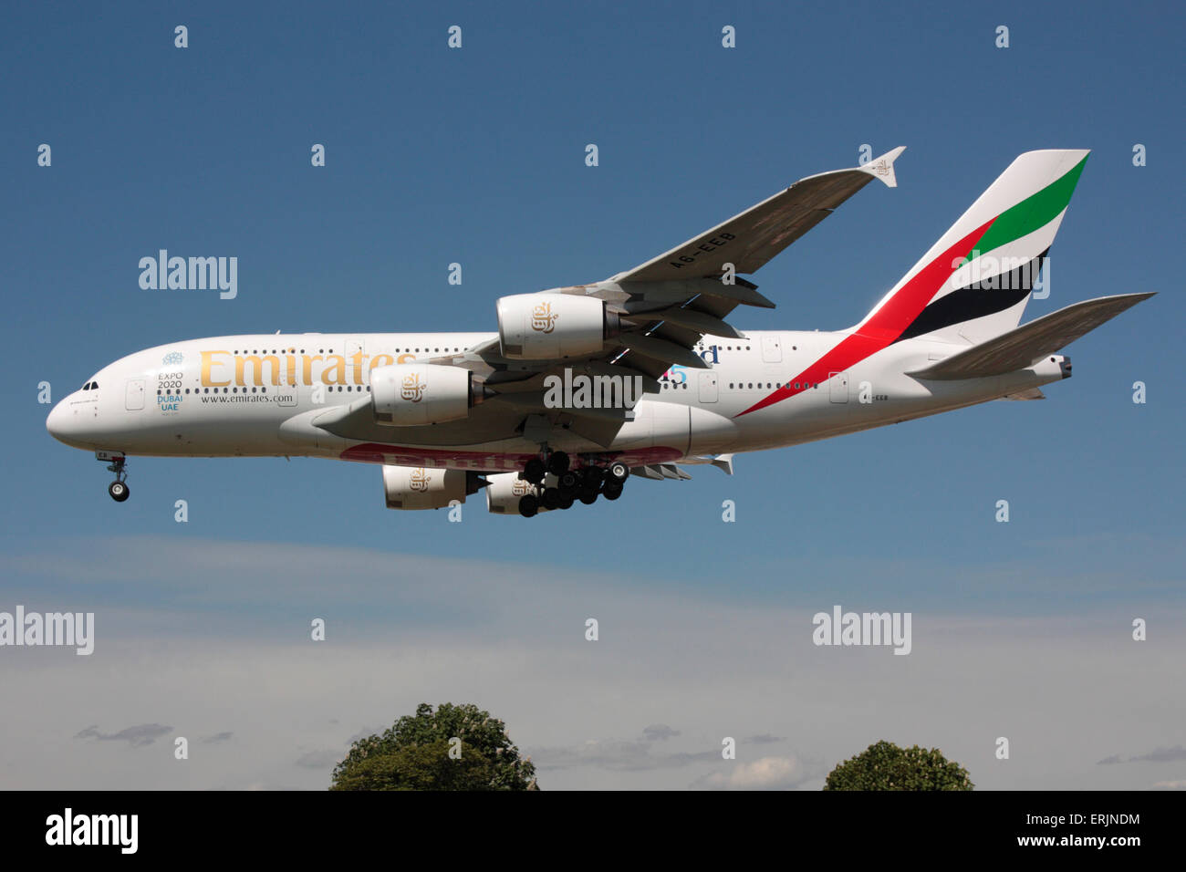 Emirates Airbus A380 long haul airliner on approach to London Heathrow. Side view. Stock Photo