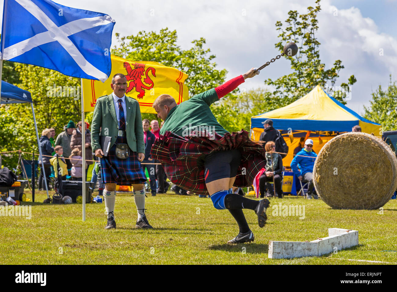 Competitor in the Carmunnock Highland games throwing the weight, Carmunnock, near Glasgow, Scotland, UK Stock Photo