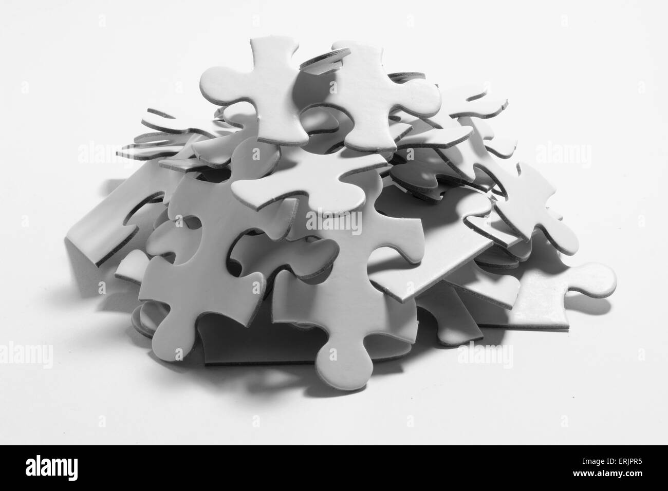 Jigsaw puzzle pieces pile Black and White Stock Photos & Images Alamy