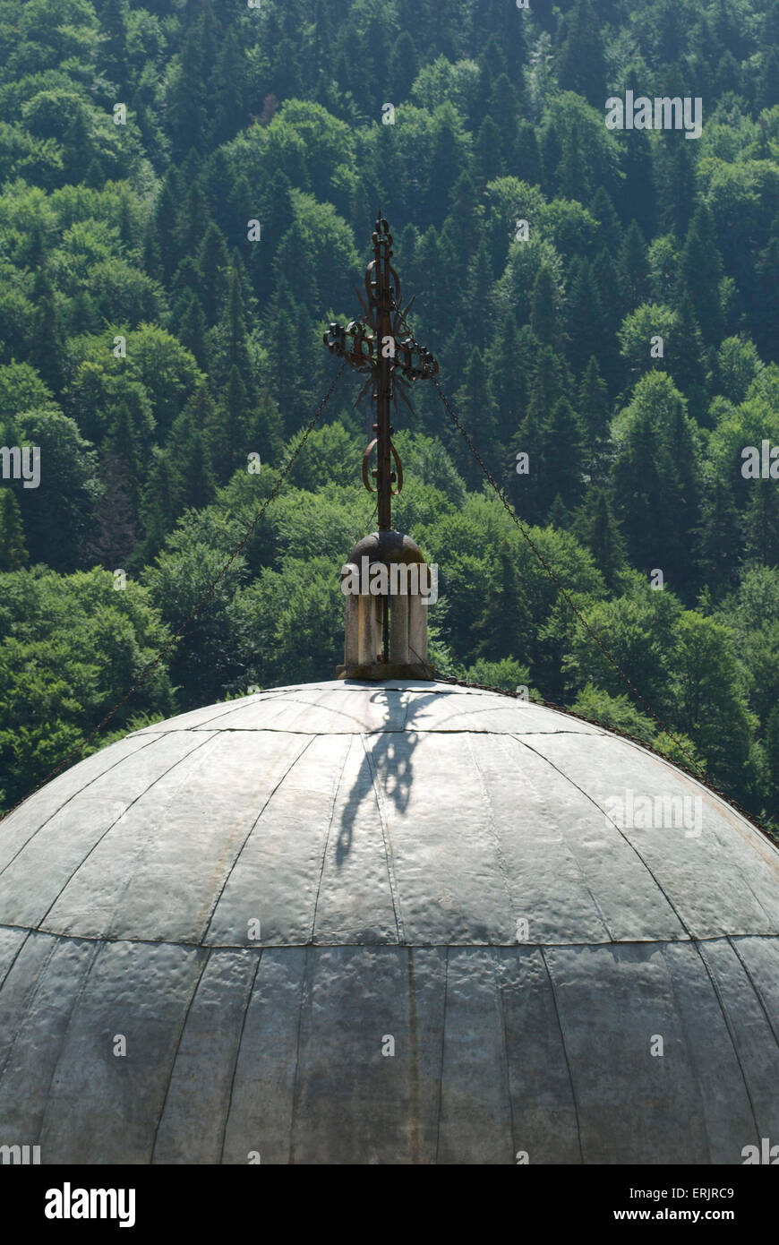 cross on top of dome in orthodox monastery with mountain backdrop Stock ...