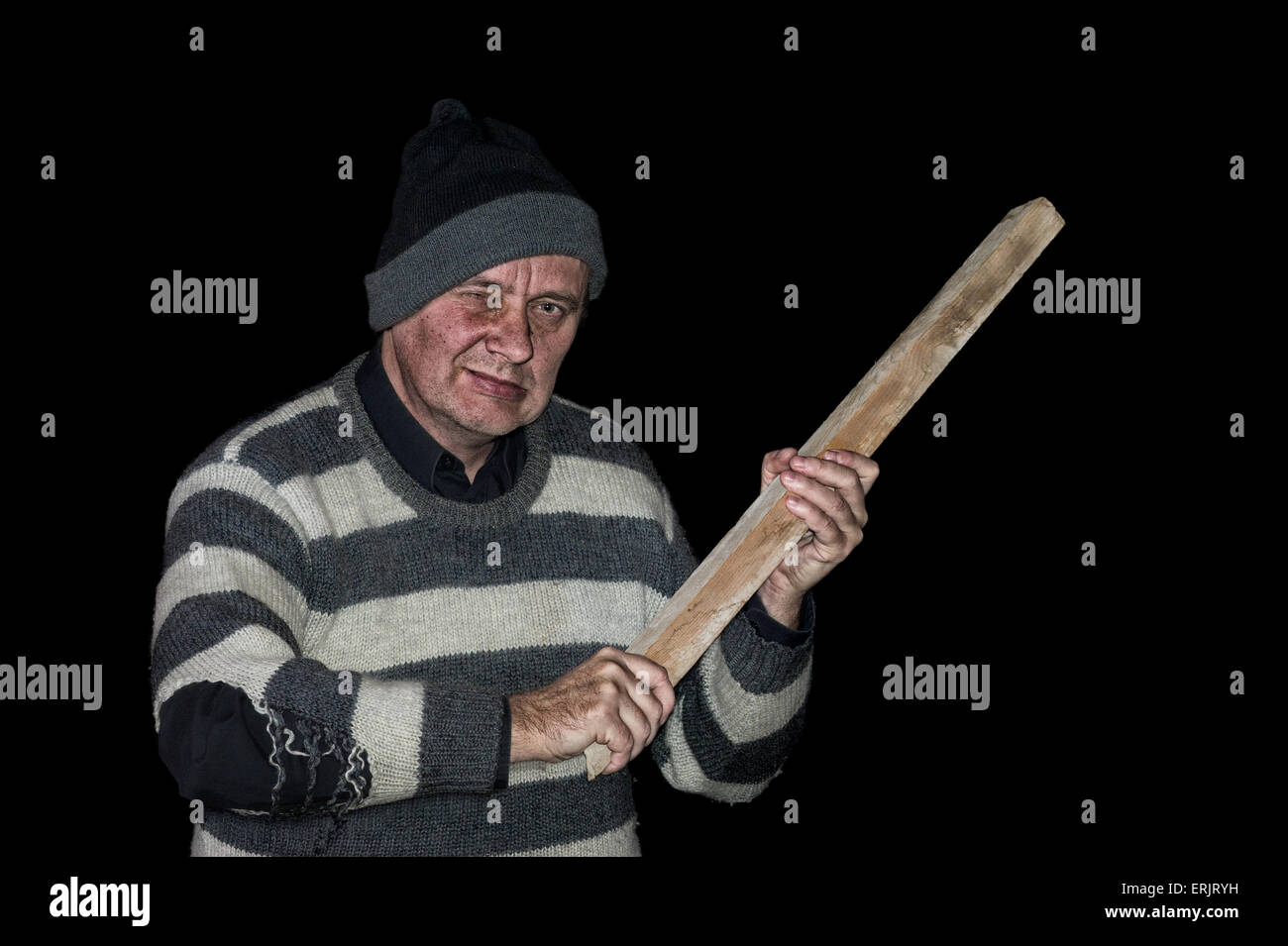 Economic crisis consequence - jobless and homeless ex-white-collar worker  trying to protect himself at dark night. Stock Photo