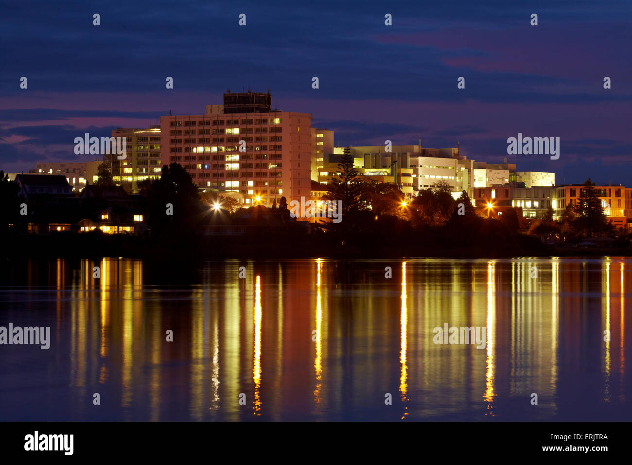 Waikato Hospital reflected in Lake Rotoroa at dawn, Hamilton, Waikato