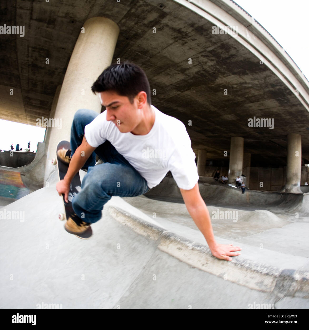 Skateboarding session in an urban skatepark Stock Photo